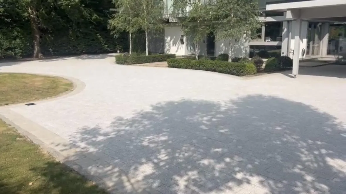 brown wooden fence on gray concrete road during daytime