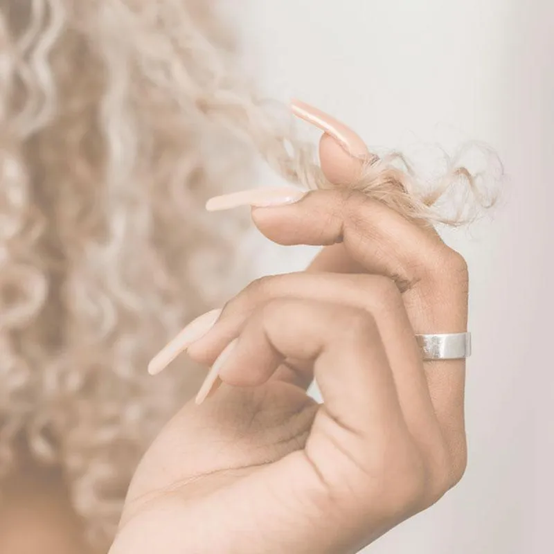 woman holding her hair 