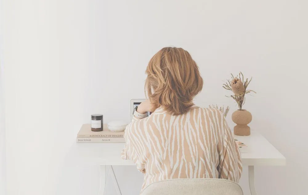 woman sitting at  desk