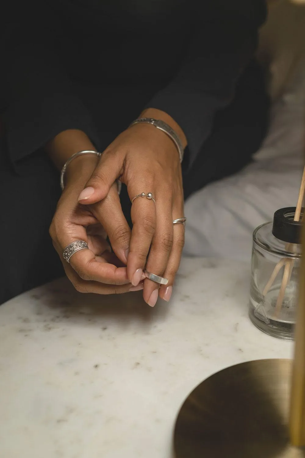woman with hands clasped and nice nails