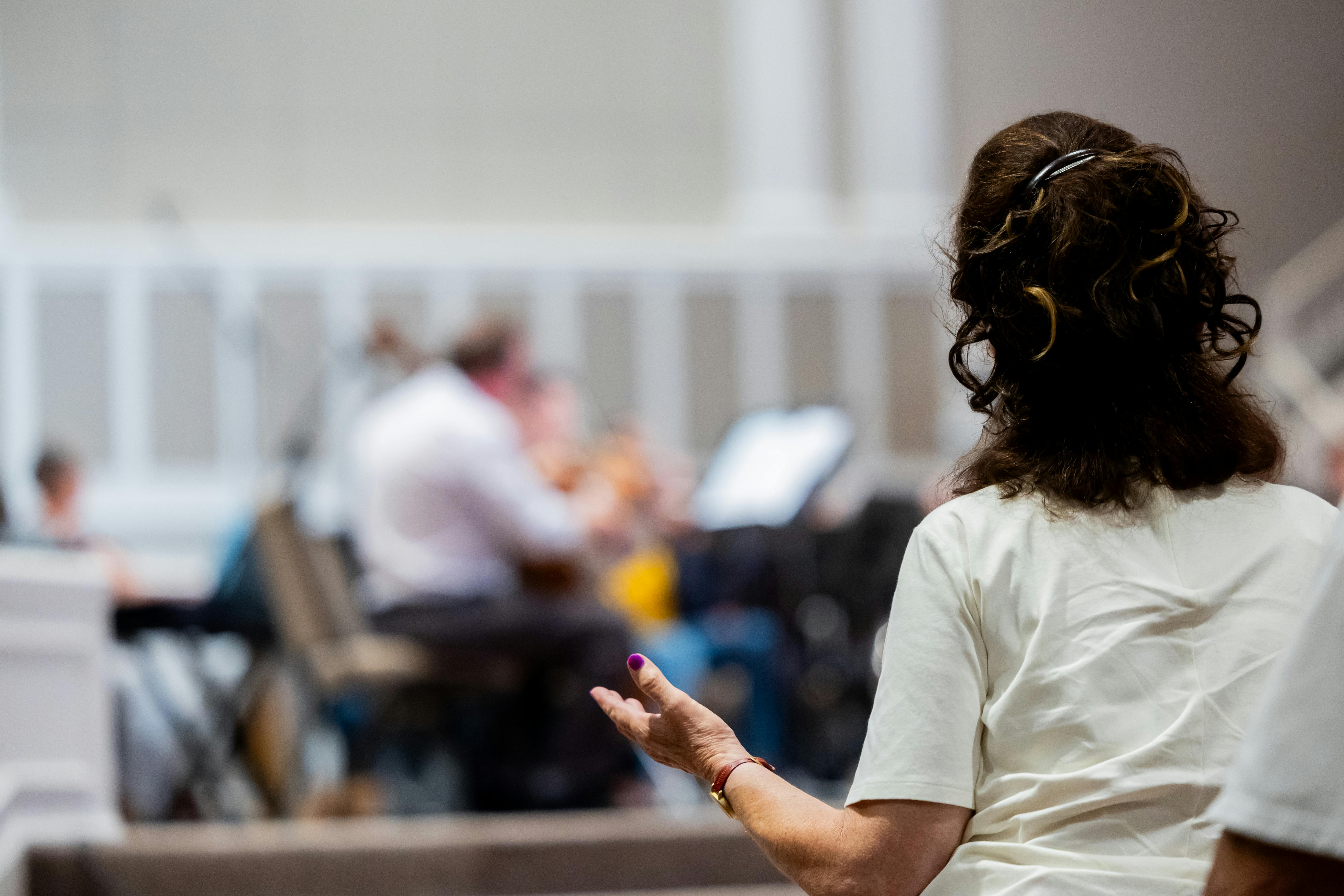 a man standing on a beach looking at the ocean