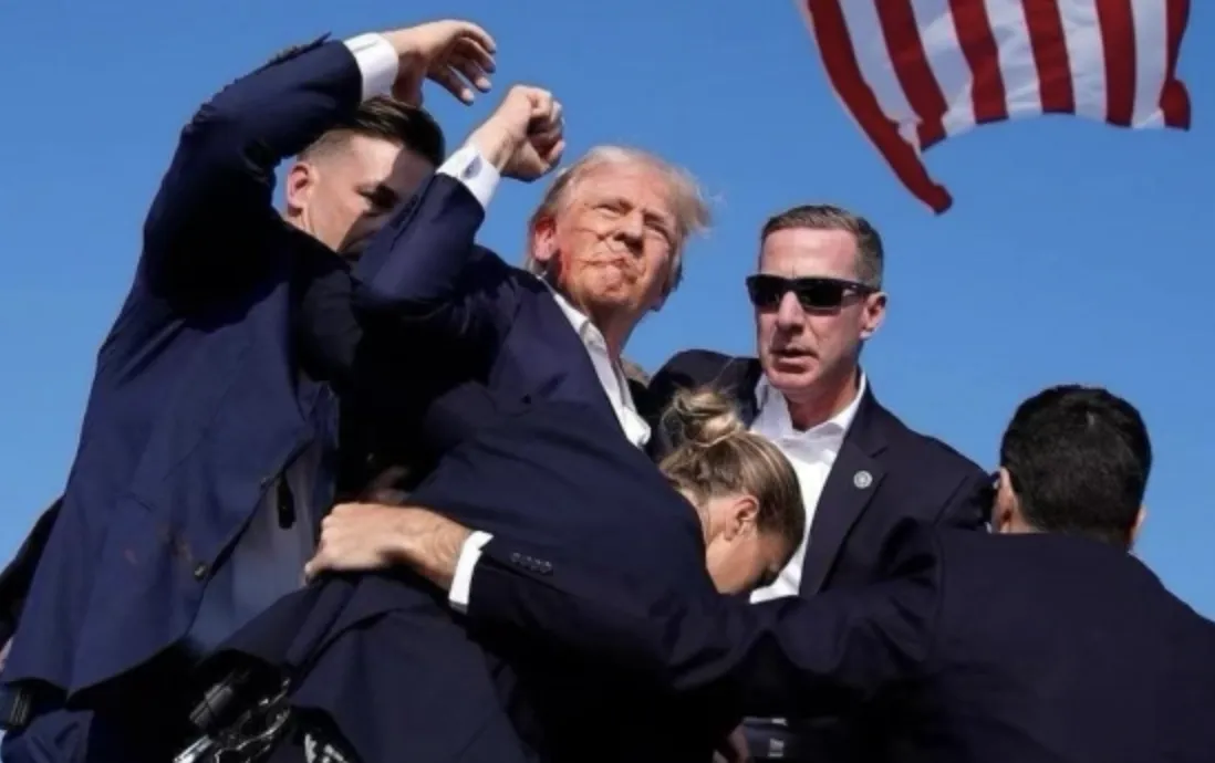 Trump Fist Up After Being Shot In Ear