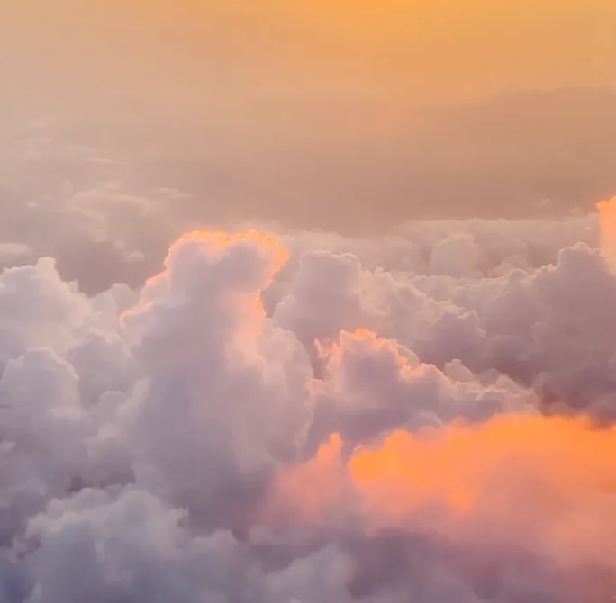 A serene pink cloud symbolizes the relationship coaching program, representing the deepening of bonds, understanding, and love between partners as they embark on the transformative journey of parenthood.