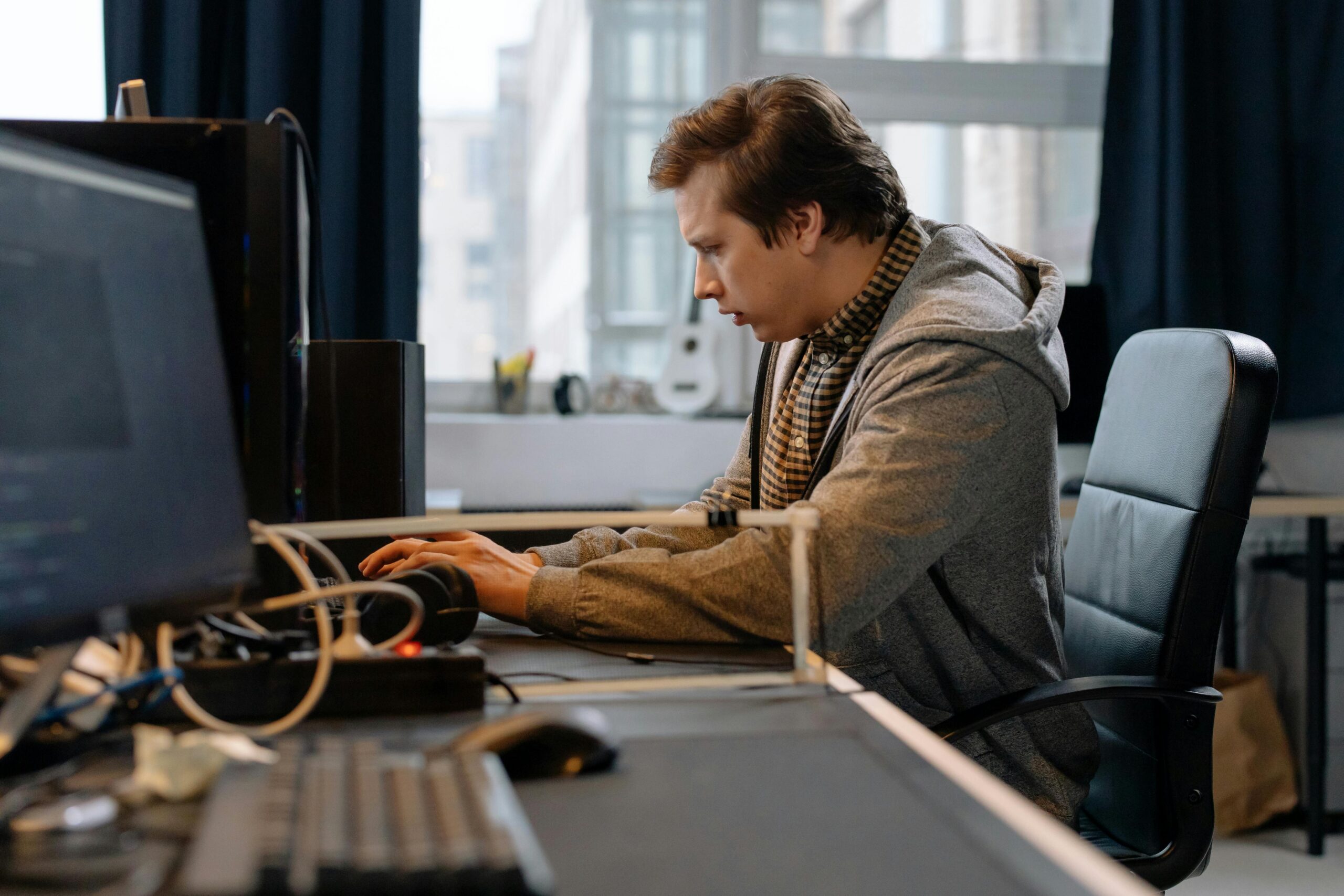 Image of a man at a computer