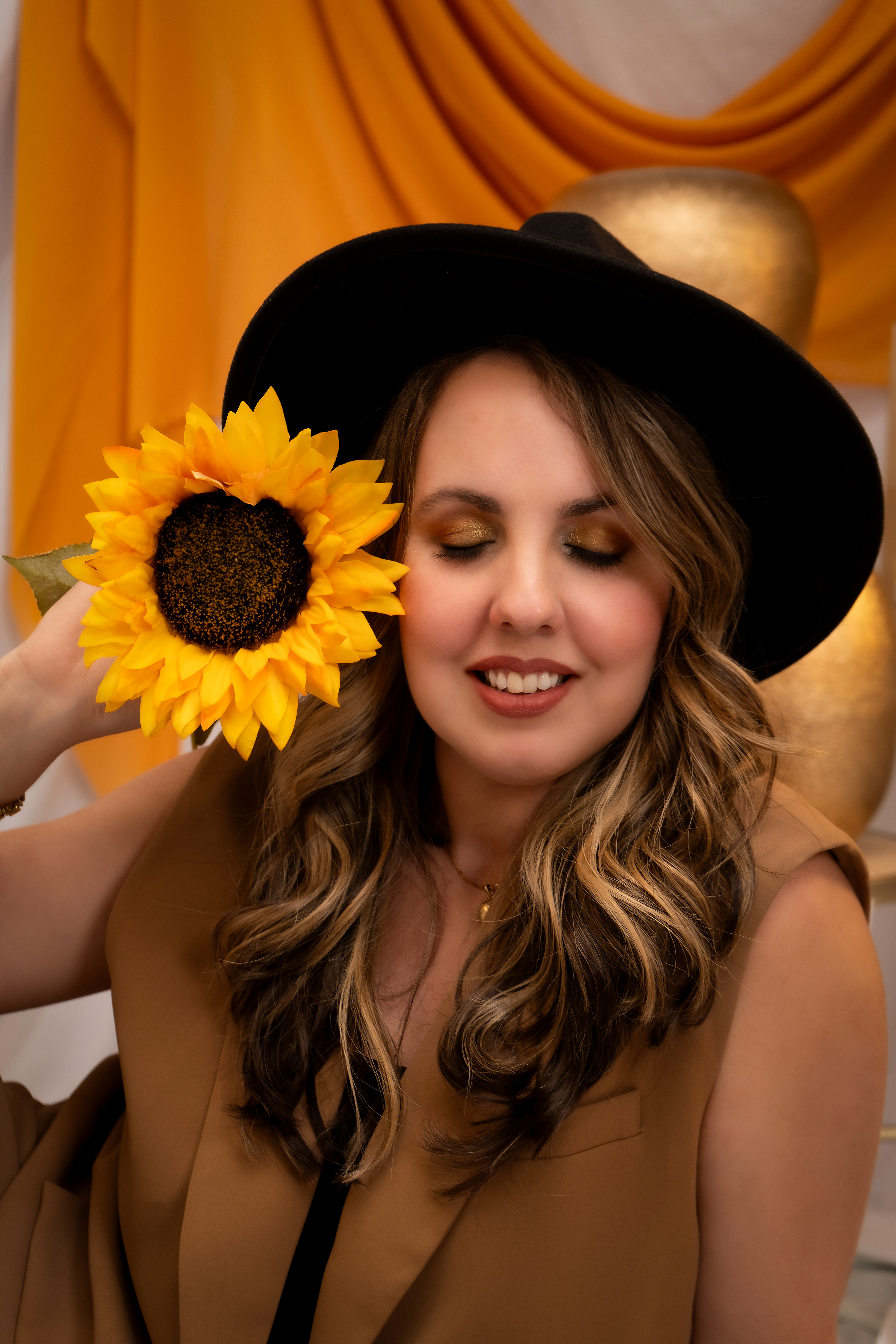 Anet Garcia, Photographer portrait with sunflower