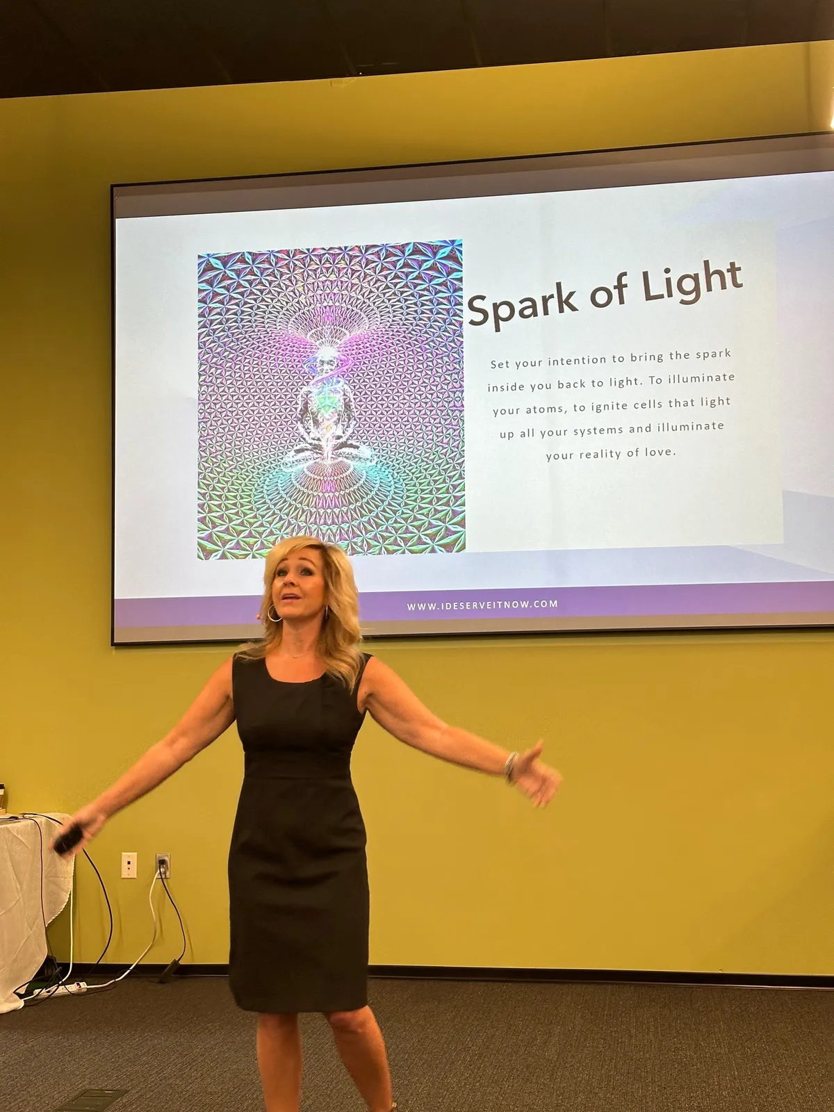 DT teaching and speaking passionately on stage at a live transformation event