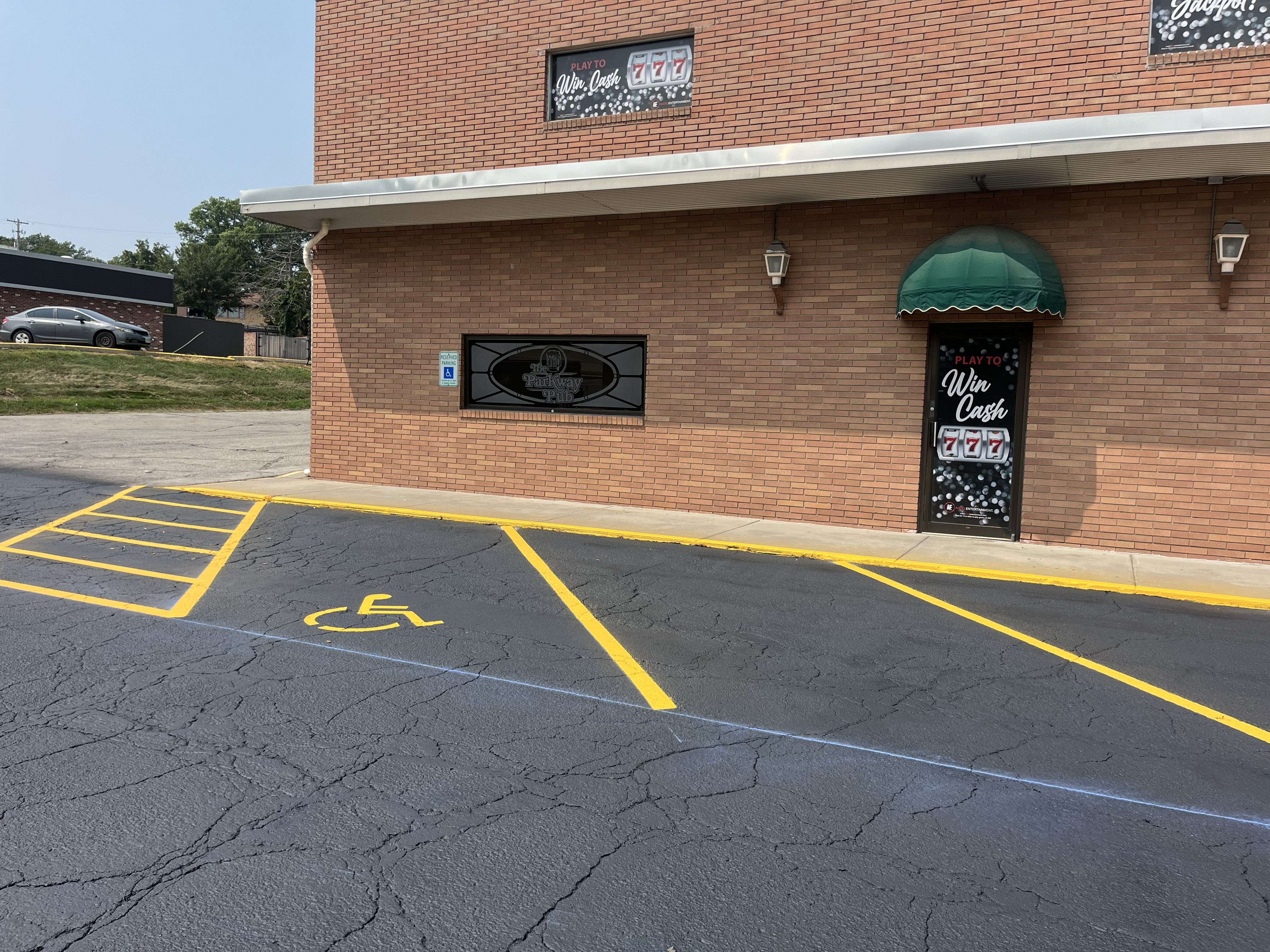 Sealcoated commercial parking lot with updated parking lines