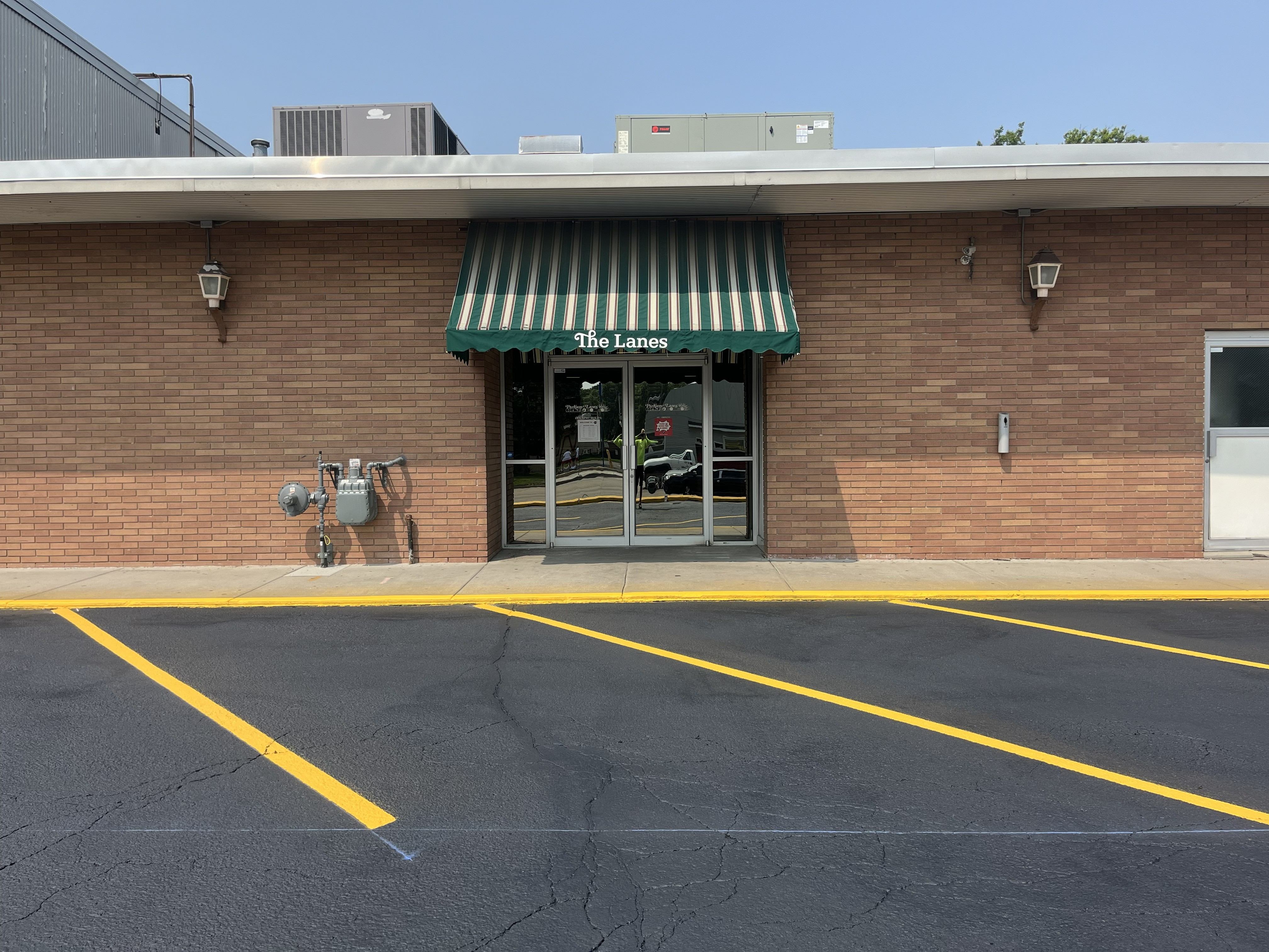 Commercial parking lot showing surface condition after sealcoating maintenance