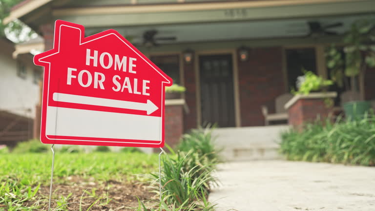 Modern living room with large windows and wood paneling
