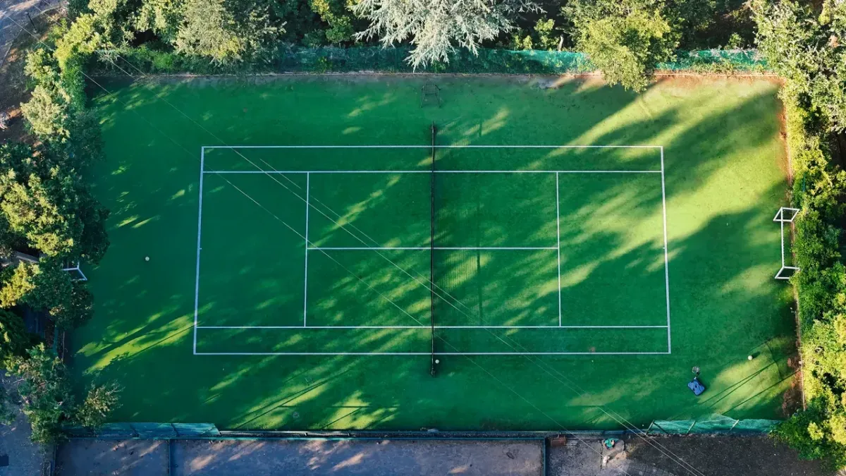 Private tennis court builders preparing a residential court for long-term play