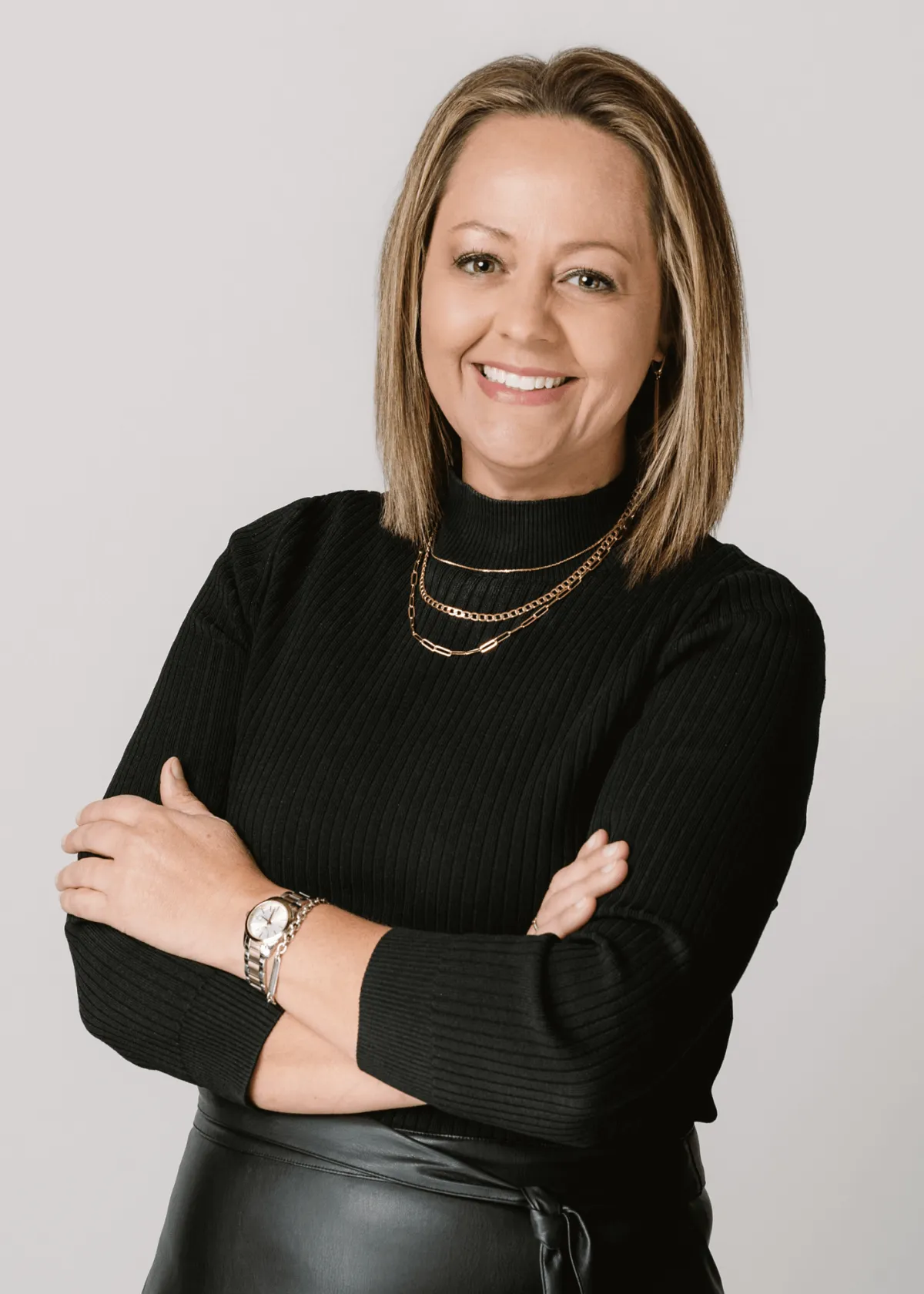 Headshot of Lisa Binggeli, top real estate broker, mentor, and creator of Agent Leader and The Brokerage Firm Fix, known for her high-performance coaching.