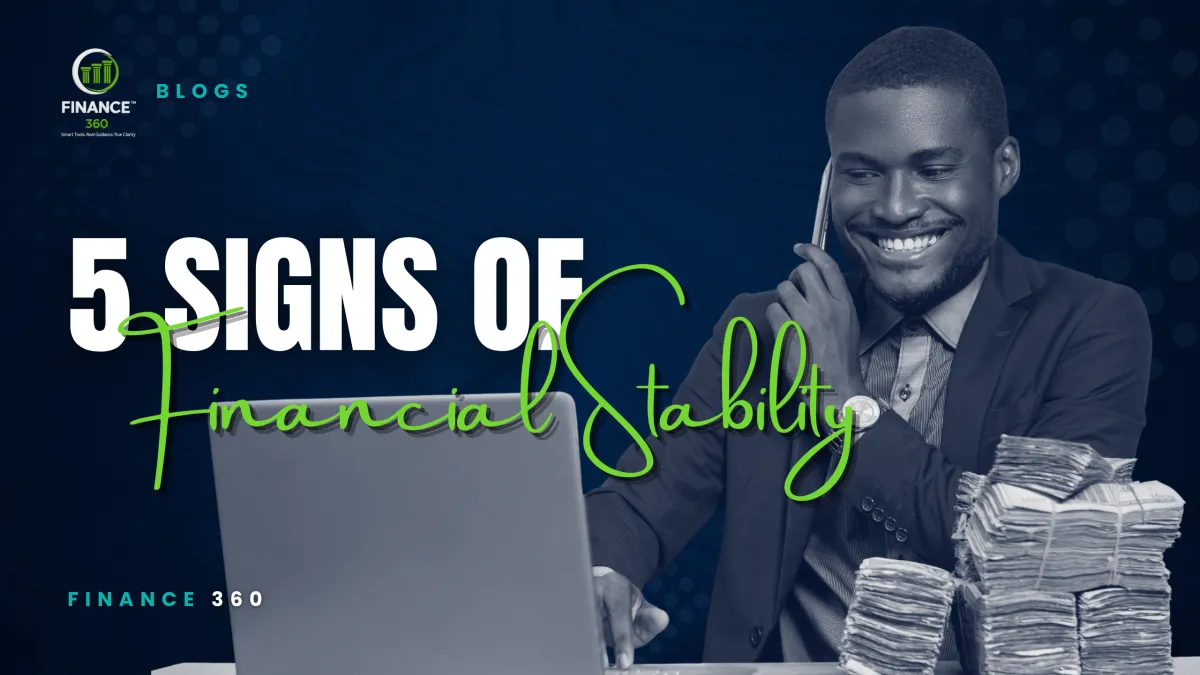 A man reviewing his finances beside cash for a blog about five signs of financial stability