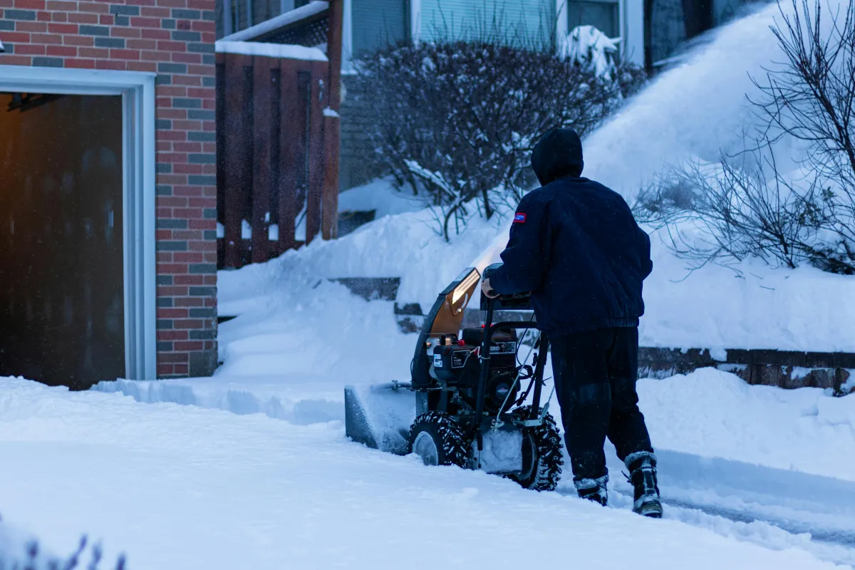 Snow removal crew clearing driveway in Wichita