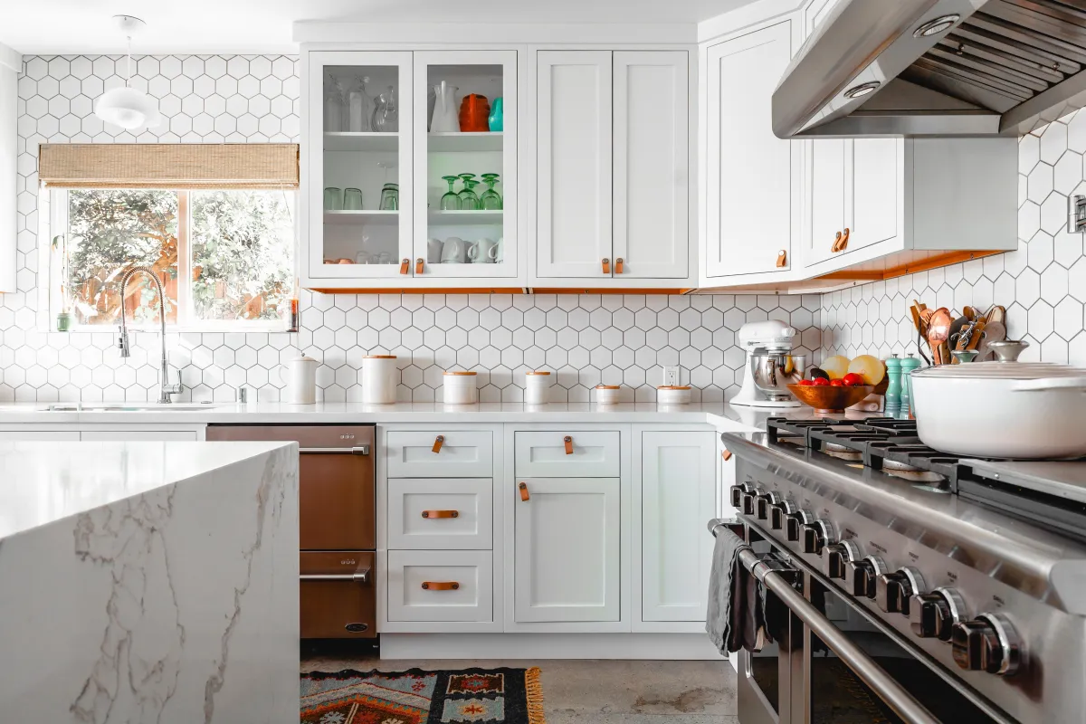 Completed kitchen remodel with white shaker cabinets in Spring