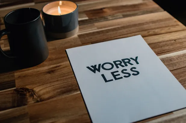Image of a sheet of paper with the words 'WORRY LESS'
