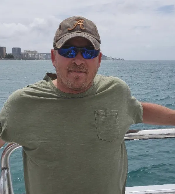 Iage of Gry Maynar on  boat in Hawaii