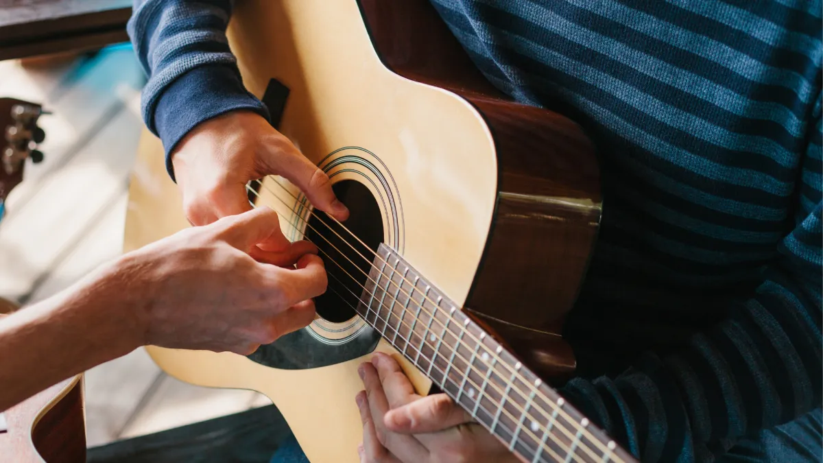 student playing guitar