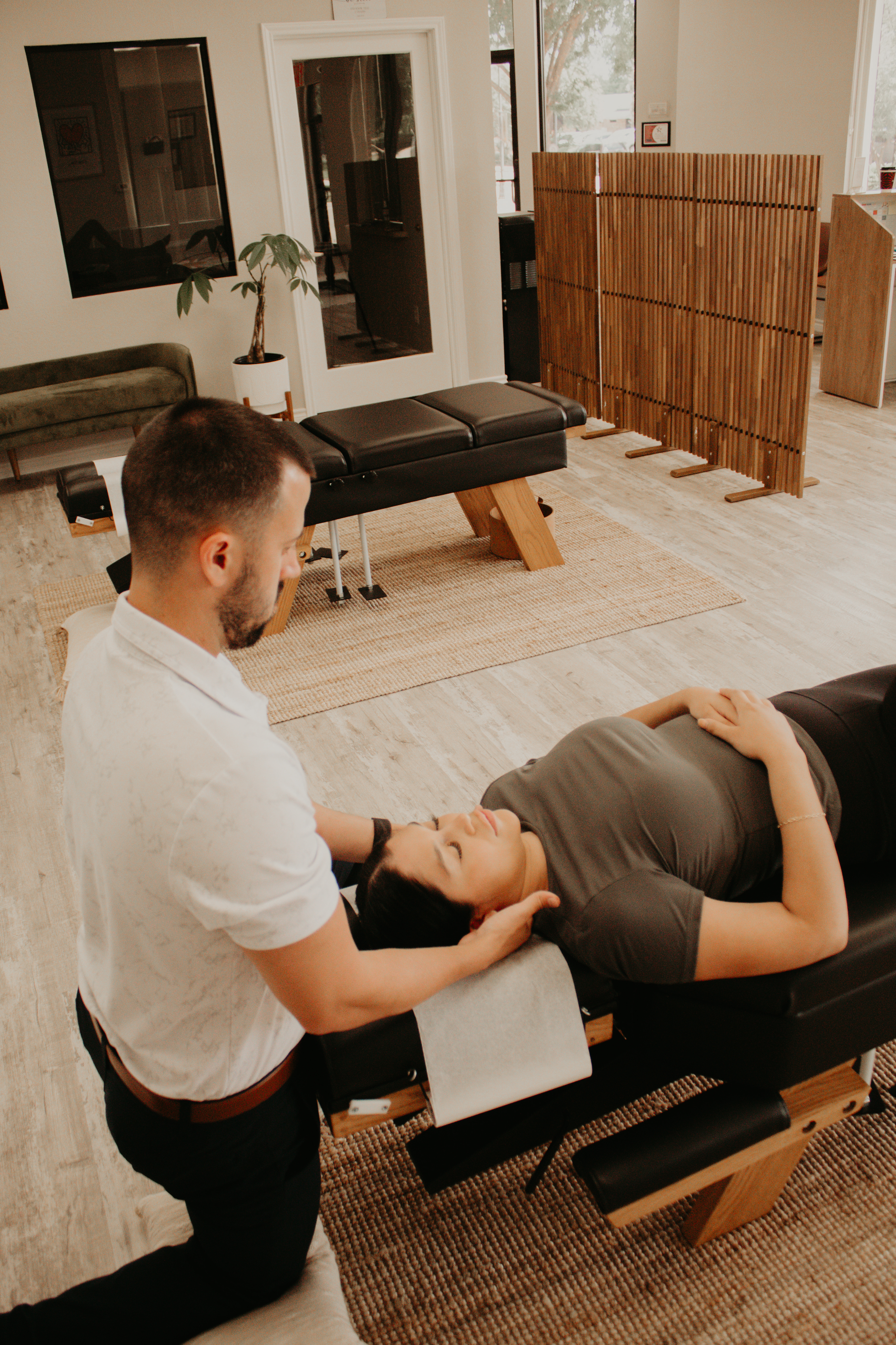 Webster-certified chiropractor in Allen, Texas providing gentle chiropractic care for a pregnant mom