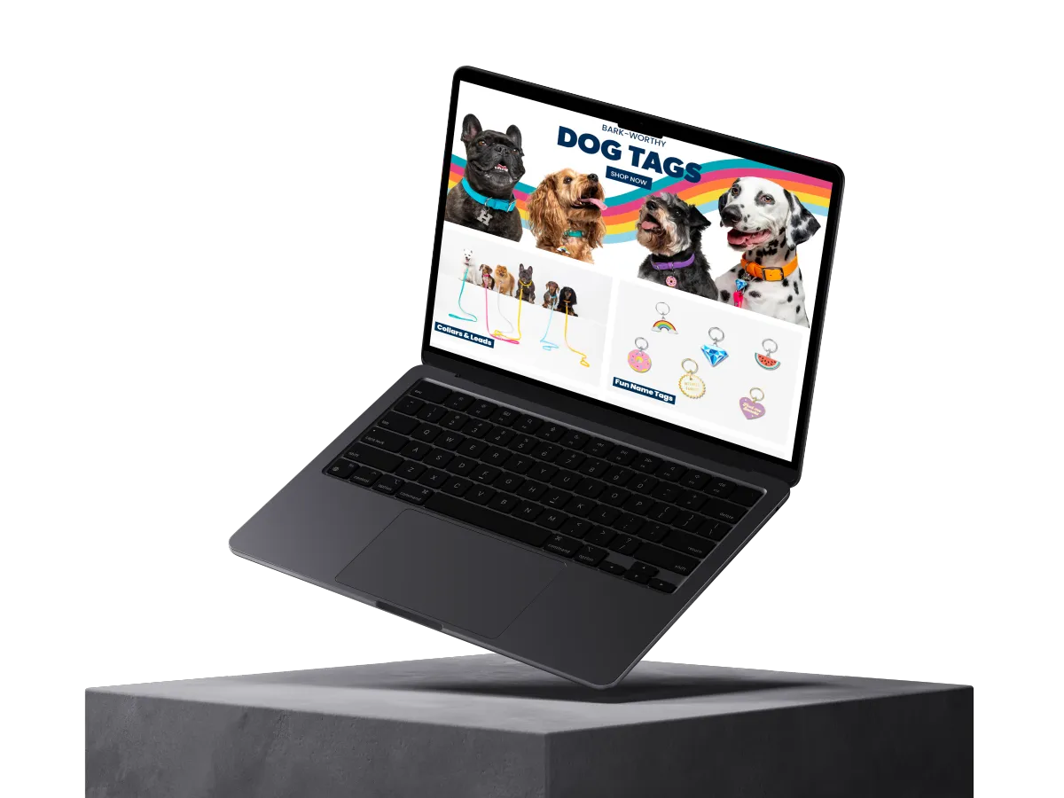 a diagonally floating laptop on a gray platform showing a website about dogs named "dog tags"