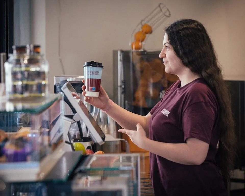Barista brewing premium coffee at La Croissanterie café in Cyprus