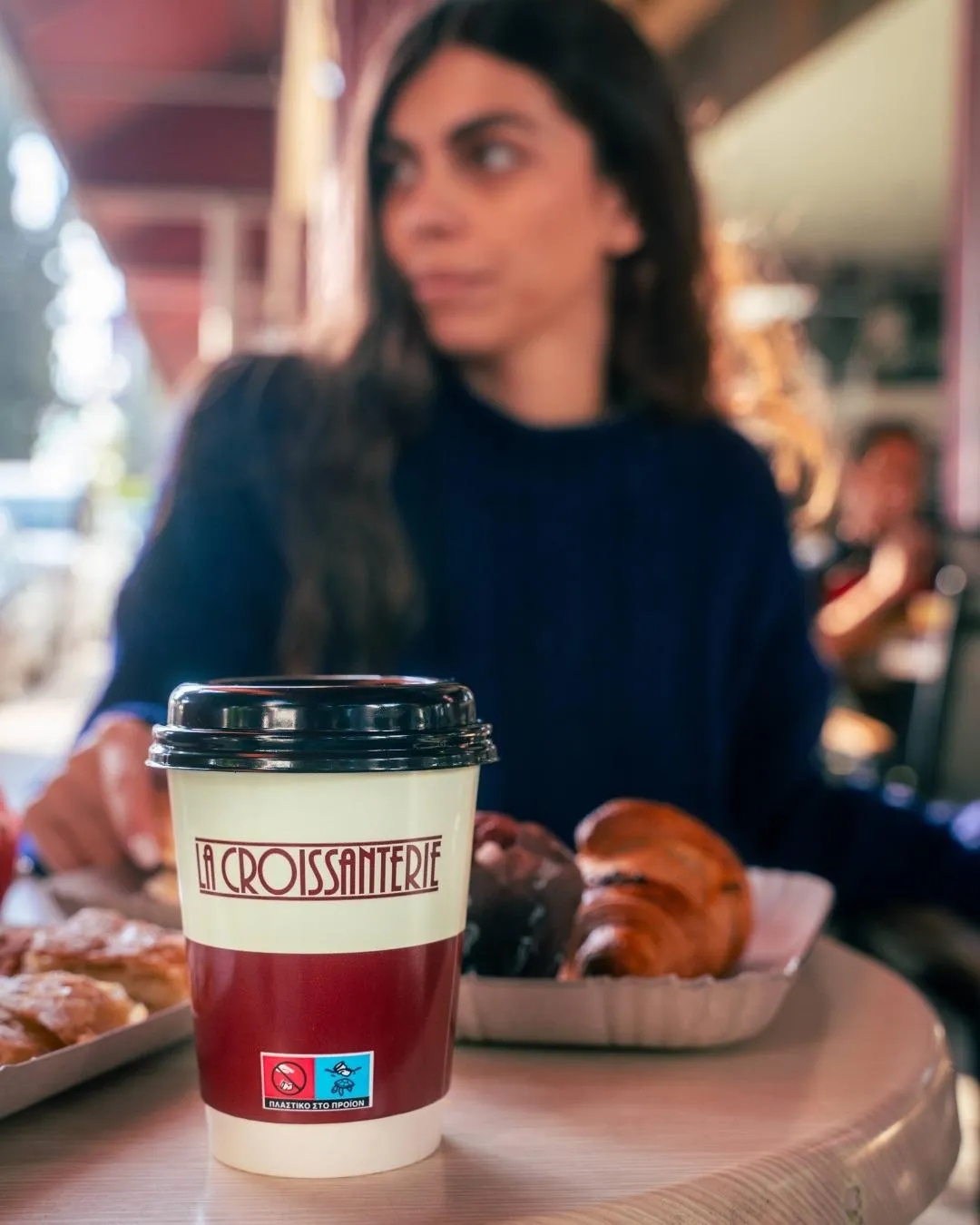 Takeaway coffee and fresh pastry at La Croissanterie in Cyprus