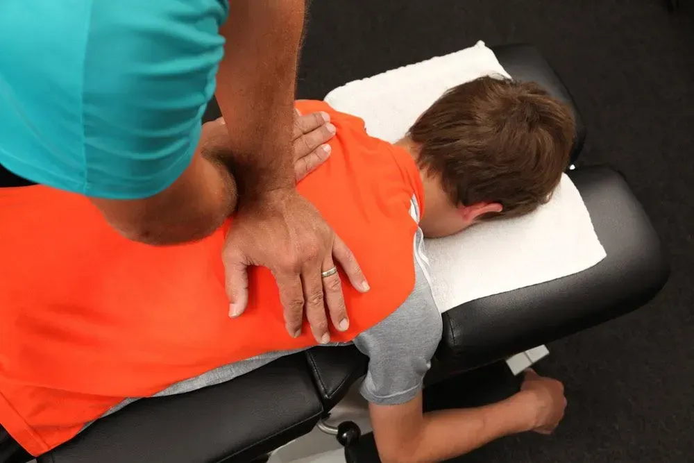 SpineEase 3000 spinal decompression table in a bright clinic room