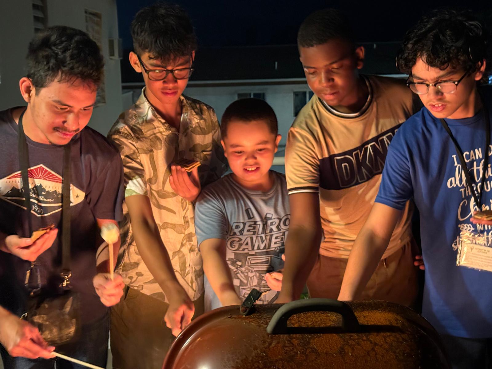 standing and sitting of people taking group photo