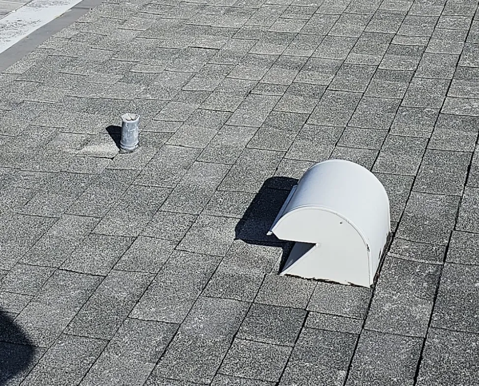 Aging pipe boot on a shingle roof ready for reseal or replacement.