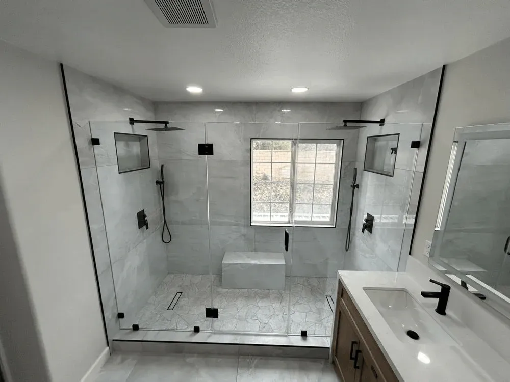 Modern kitchen remodeling in Mentone CA featuring sleek cabinets, stainless steel appliances, quartz island, and natural light.