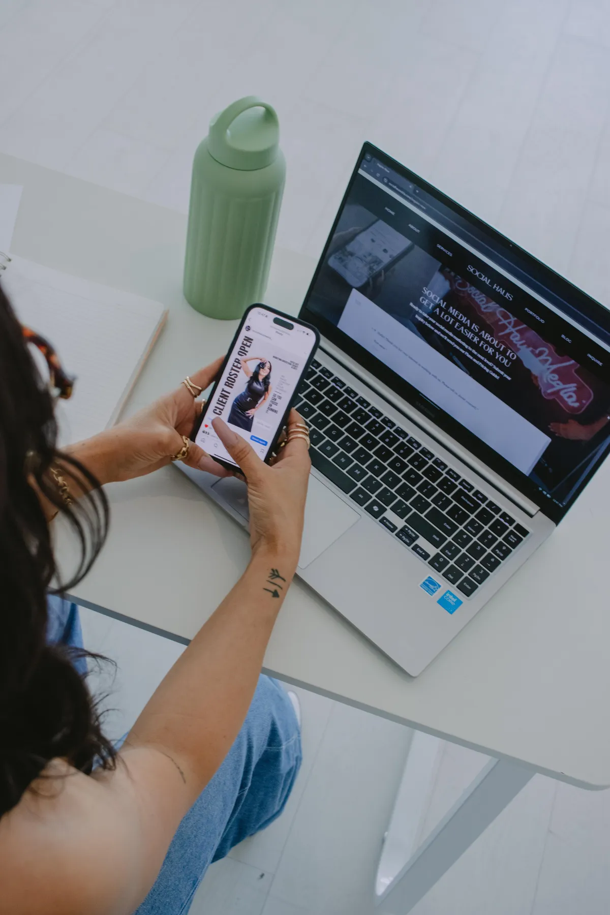 a woman on social media near a laptop