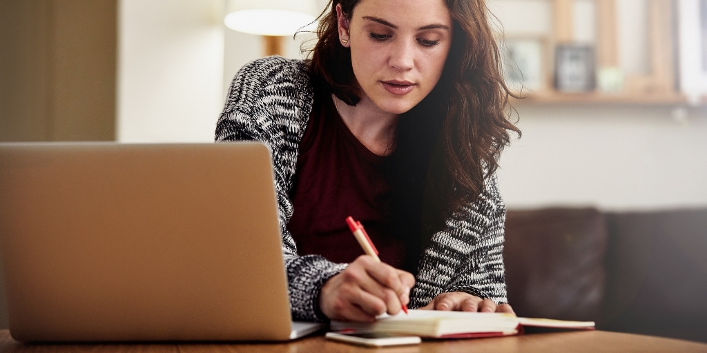 A woman checking off a to-do list