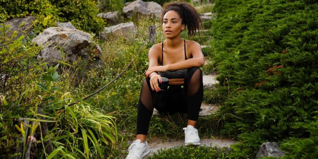 A woman sitting after a workout
