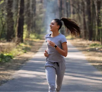 oung woman jogging outdoors, representing VitalQi’s personalized herbal medicine in Cupertino for natural, root-cause wellness support.