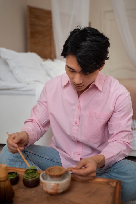 man preparing matcha tea, learning healthy lifestyle habits from alternative medicine practitioner in cupertino ca.