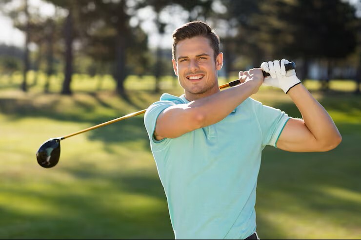 man swinging a golf club, feeling strong and healthy thanks to care from a holistic medicine practitioner in cupertino ca.
