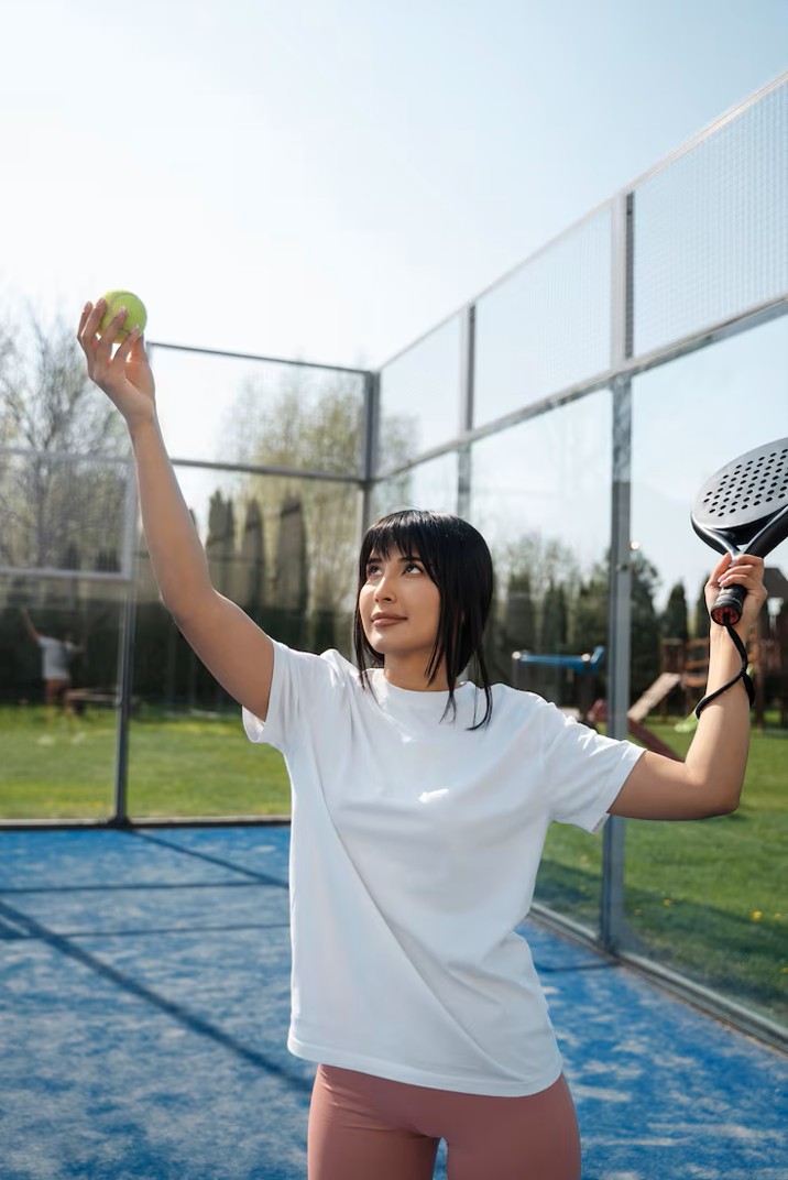 woman playing paddle tennis with confidence after womens health acupuncture in cupertino ca.