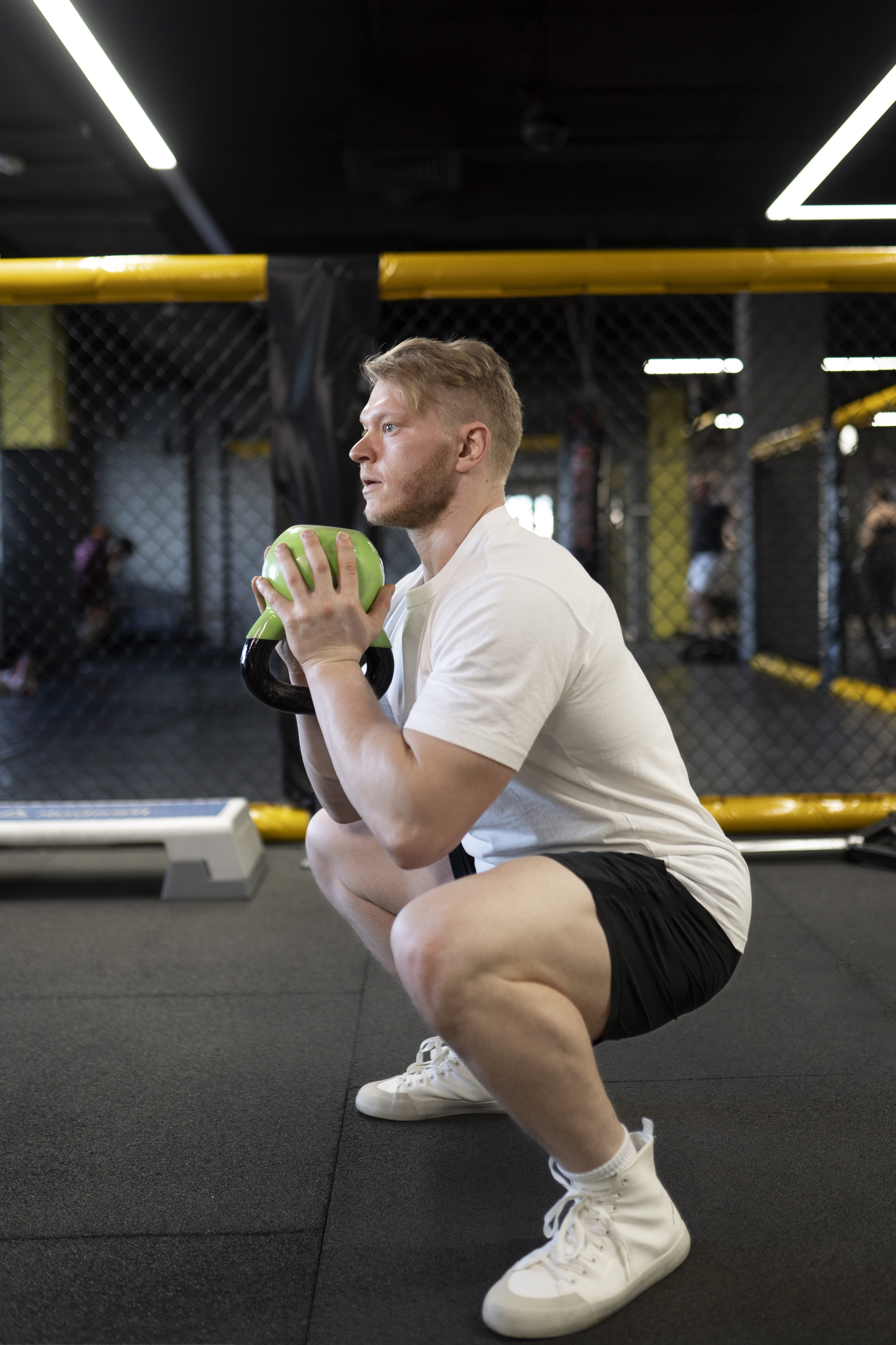 man performing deep lunges on a track with help from an acupuncture clinic in cupertino ca.