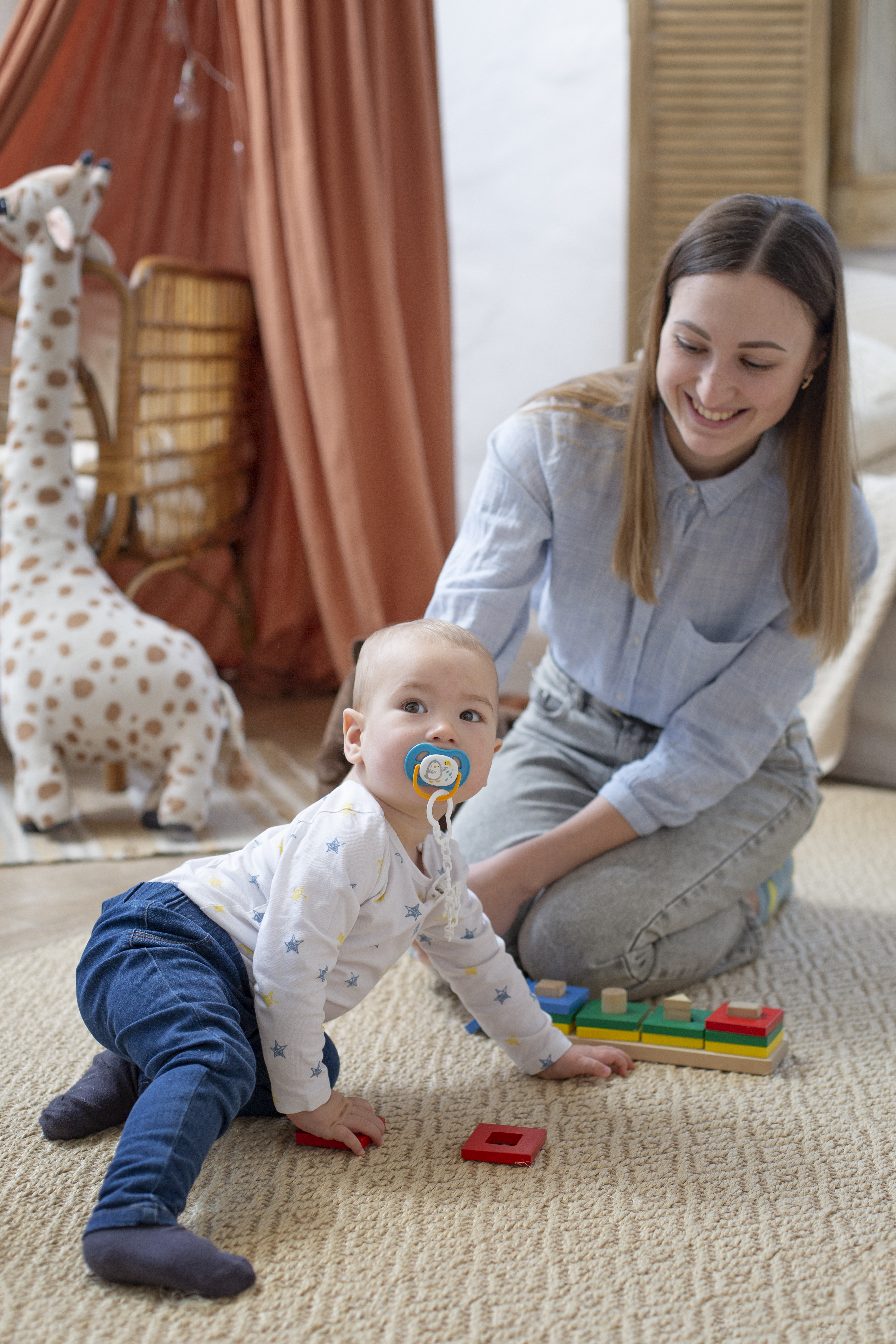 happy mother and healthy baby playing together after successful care at an ivf acupuncture clinic in cupertino ca.
