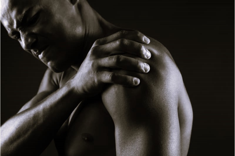 Woman with lower back pain sitting at desk