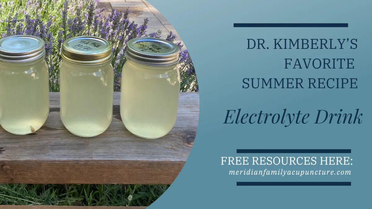 Three mason jars filled with homemade lemon electrolyte drink on a wooden table with blooming lavender in the background, promoting Dr. Kimberly’s favorite summer hydration recipe.