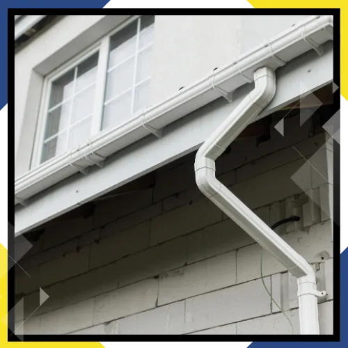 Rainwater moving through a newly installed gutter system