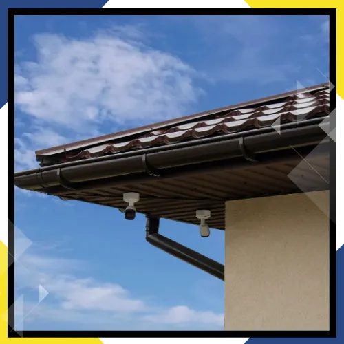 Rain gutter installation team working carefully outside 