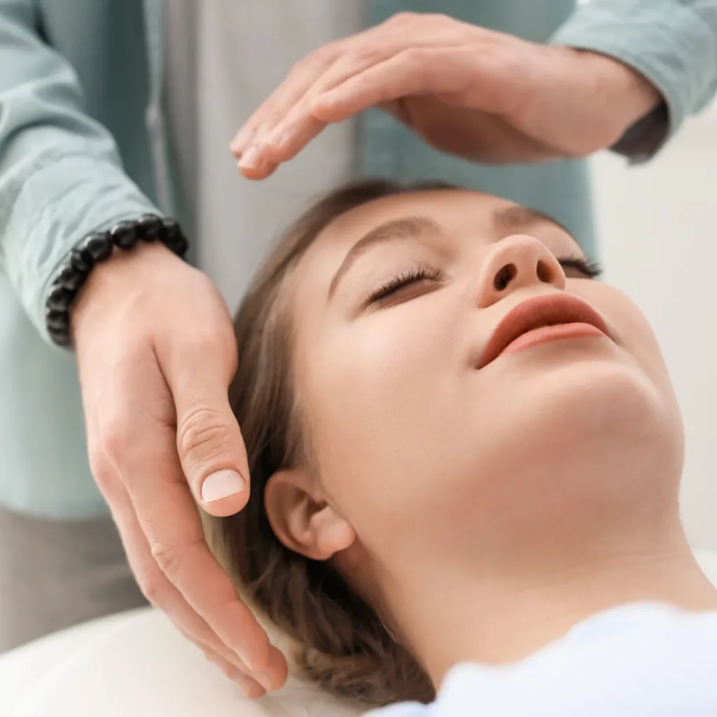 opened book near brown wood branch on sand under blue sky