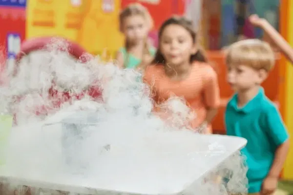 Girl follows directions during arts and crafts time.