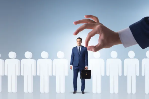 A businessman in a suit addresses a group of people,, outsourcing a virtual assistant