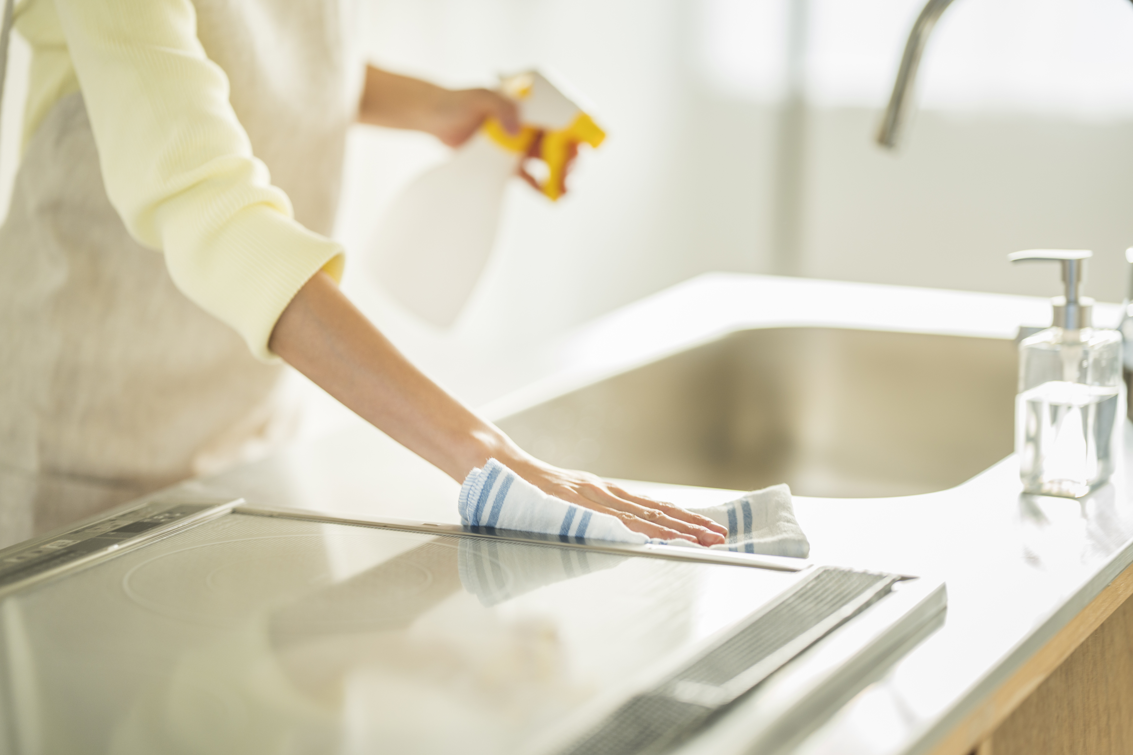 Small white building with arched doorway and wooden door.