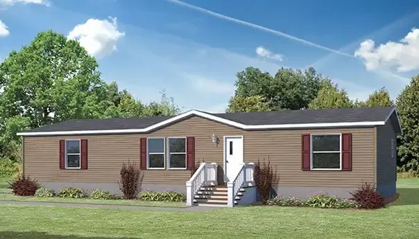 A single-story brown manufactured home with a white front door, red shutters, and a small front porch, surrounded by a grassy lawn and trees.