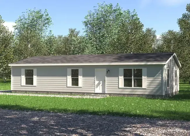 A single-story, gray-paneled house from Houston Berk Manufactured Homes with a dark roof, two front windows, and a central door, set on a lawn with surrounding trees.