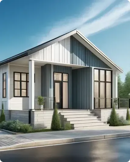 A modern, small, single-story house with a sloped roof, gray and white exterior, large windows, and an elevated front porch with steps, set against a clear blue sky.