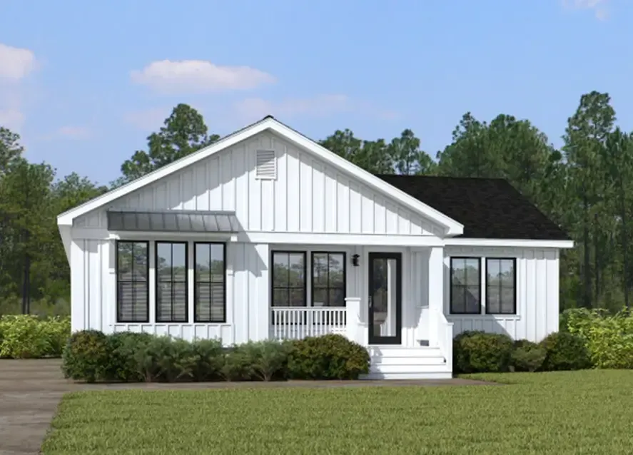 A charming one-story white house with black trim, a porch, and a black roof, surrounded by a green lawn and trees in the background—a quintessential example of Houston Azalea Manufactured Homes.